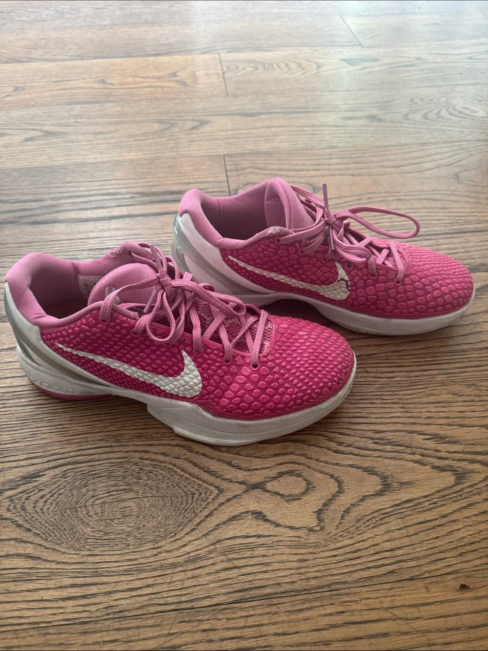 Nike Pink Low-Top Basketball Sneakers with White Swoosh